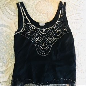 Black top with sequin detail!